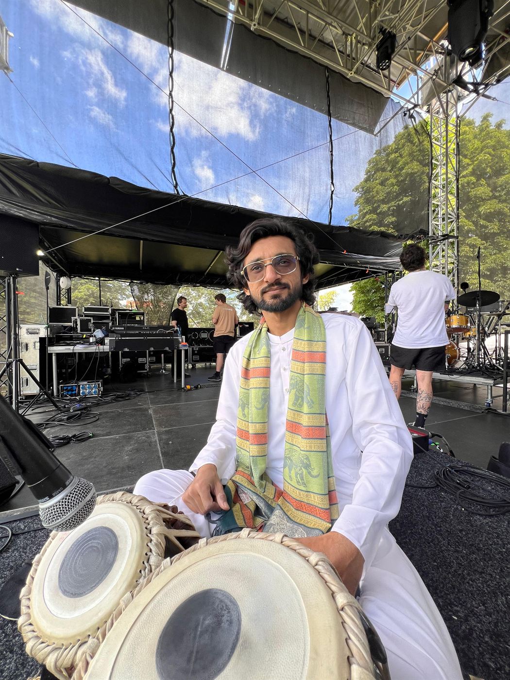 Asher Shehzad seated at the tabla on stage